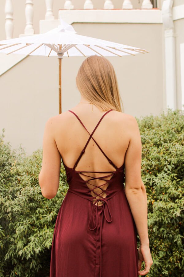 Rent the Flowy Maroon long maroon dress with frills, adjustable straps, and tie-back in Stellenbosch, South Africa from Rokkies.