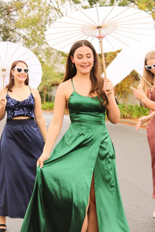 Rent a long silky green dress with adjustable tie-back straps and high slit in Stellenbosch, South Africa from Rokkies.